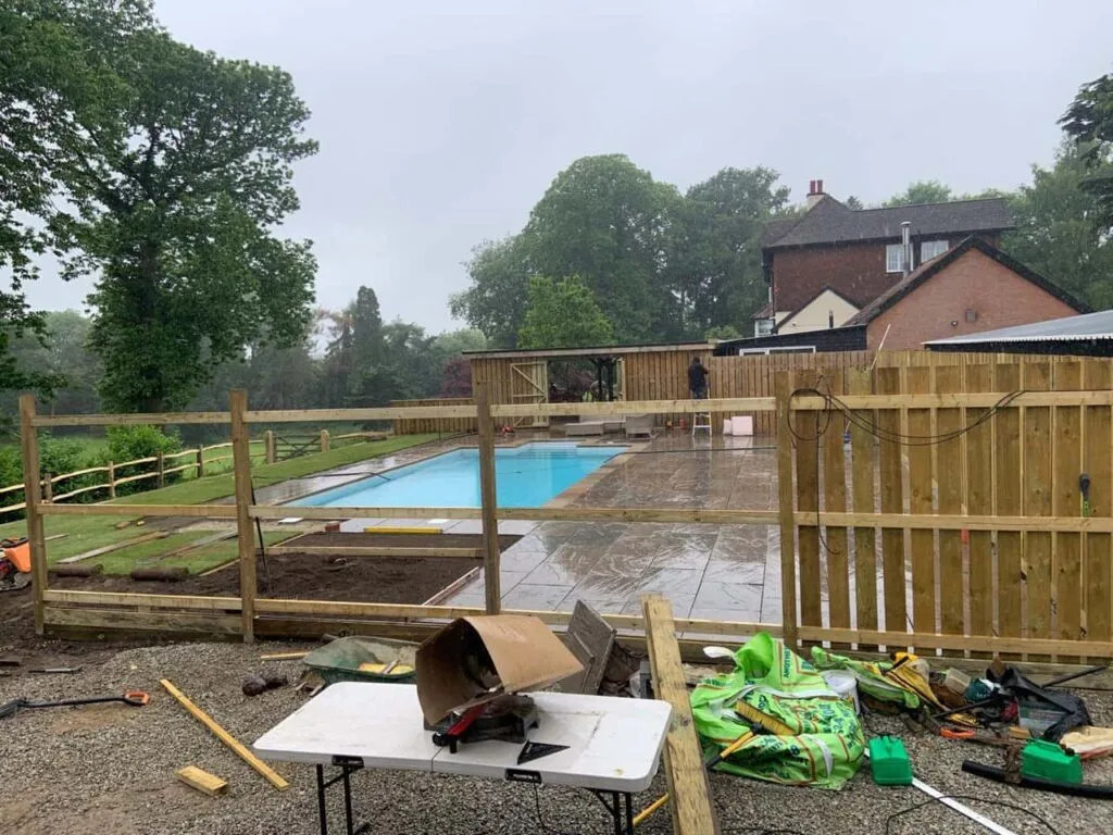 This is a photo of Bespoke custom fencing installed around a swimming pool by Fast Fix Fencing Ashford