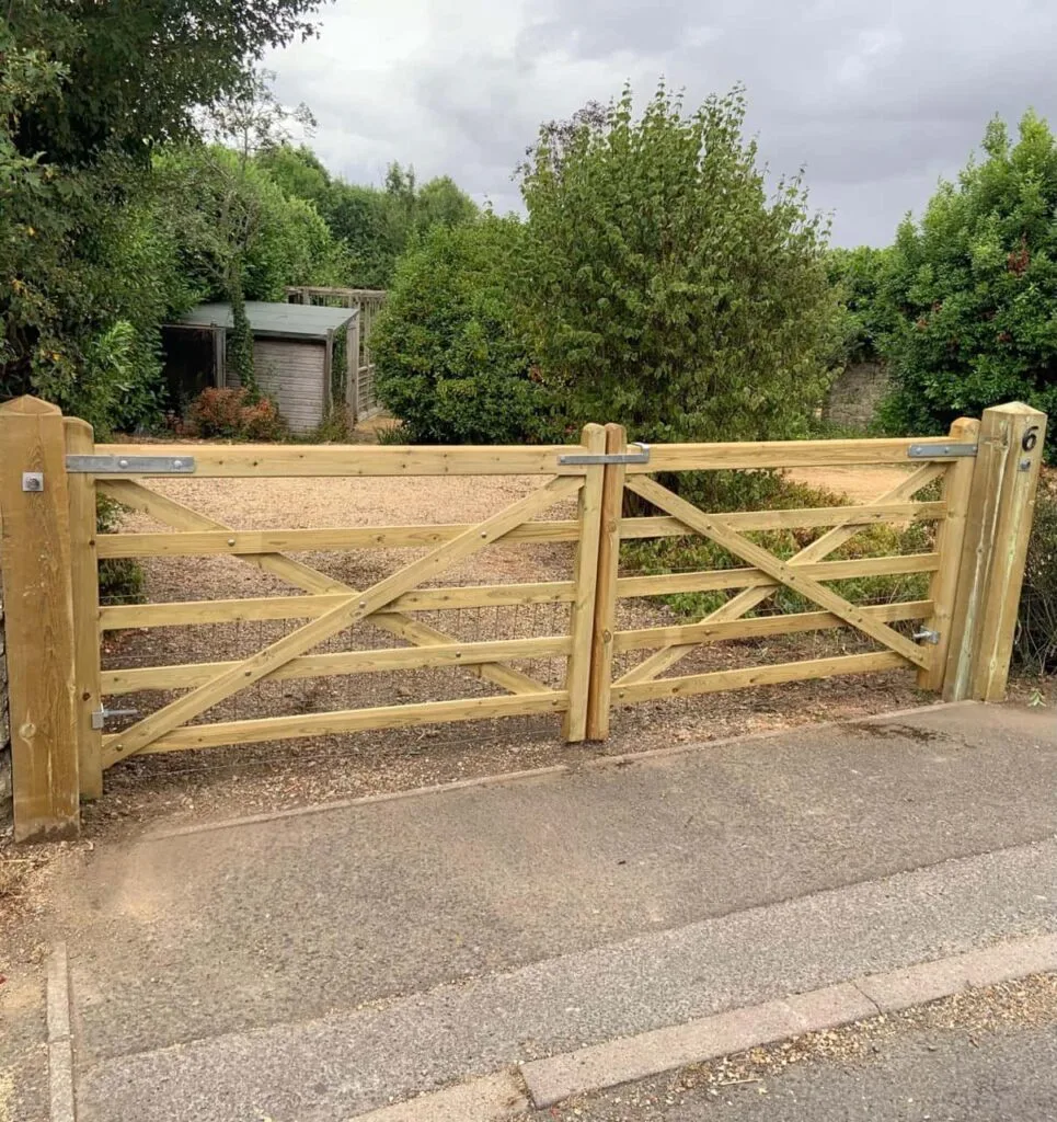 This is a photo of a wooden driveway gate installed by Fast Fix Fencing Ashford